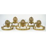 A set of three 19th century bronze four light wall appliques,