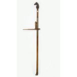 A mahogany and brass inlaid horse measuring stick, with carved horses head finial and hoof base,
