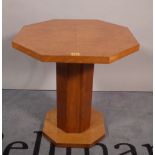 A mid-20th century Art Deco birdseye maple and walnut octagonal occasional table on plinth base,