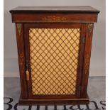 A Victorian marquetry inlaid walnut pier cabinet, with single brass grille door, on plinth base,