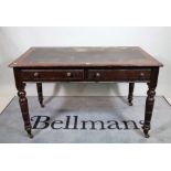 A 19th century mahogany two drawer writing table on ring turned supports, 120cm wide x 75cm high.