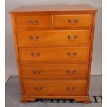 A 20th century cherrywood tall chest of two short and four long graduated drawers, on bracket feet,