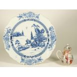 A Chinese blue and white export dish, Qianlong, painted with two figures in a river landscape,