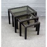 PIERRE VANDEL PARIS; a nest of three glass inset metal occasional tables,