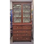 An early 19th century inlaid mahogany secretaire cabinet with pair of astragal glazed doors over