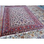 An Esfahan carpet, Persian, the ivory field with an allover palmette and floral vine design,