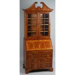 An early 18th century style yew bureau bookcase,