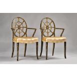 A pair of George III style polychrome painted web back open armchairs with bow seats on splayed