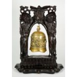 A Chinese bronze bell, early 20th century, cast with a dragon chasing a flaming pearl,