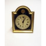 A Swiss gilt metal and simulated lapis lazuli keyless wind alarm clock,