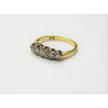A gold and diamond set five stone ring, mounted with a row of circular cut diamonds,