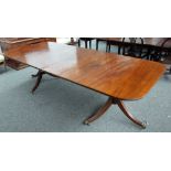 A George III style mahogany D-end extending dining table on six downswept supports,