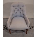 A blue upholstered tub back easy chair on turned and fluted supports, 66cm wide x 82cm high.