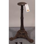 A late Victorian cast iron table base with acanthus outswept supports, 68cm high.