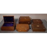 A group of seven mahogany/ oak cutlery boxes of various sizes, the largest 49cm wide x 14cm high,