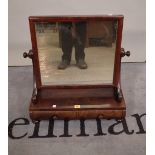 A William IV walnut two drawer toilet mirror on bun feet, 54cm wide x 61cm high.