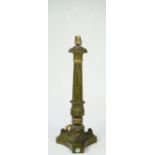 A Victorian style gilt metal table lamp of Corinthian column form with later distressed green paint,