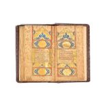 A Qur'an, illuminated Arabic manuscript in naskhi script on gold-sprinkled paper,