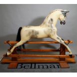 'Haddon Rockers', a 20th century fibreglass rocking horse, on a pine frame, 170cm wide x 130cm high.