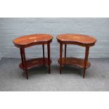 A pair of Edwardian marquetry inlaid satinwood banded kidney shaped two tier occasional tables on