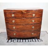 A late George III mahogany bowfront chest of two short and three long graduated drawers,