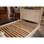 A 20th century white painted double bed, 165cm wide x 140cm high.