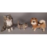 A 20th century glazed ceramic model of a cat, 24cm high, a smaller Doulton cat,