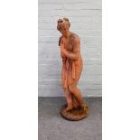 A reconstituted stone figure of bathing Venus, in standing pose, on circular base, 117cm high.