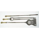 A set of three Georgian steel fire tools with pierced plate and geometric square brass handles,