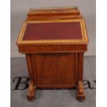 A Victorian mahogany Davenport with fitted galleried super structure over sloped front and four