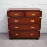 A campaign style brass bound mahogany chest with two short and three long graduated drawers,