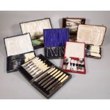 A group of seven cased flatware sets, (7).