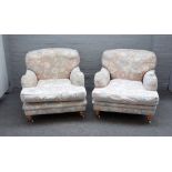 A pair of Howard style easy armchairs on turned beech supports, 80cm wide x 80cm high.