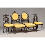 A 19th century ivory marquetry inlaid ebonised salon suite to comprise; open arm sofa,