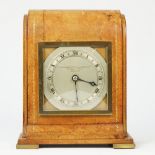 An Edwardian leather desk timepiece retailed by the Goldsmiths & Silversmiths, London, by Elliott,