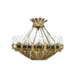An ormolu and patinated bronze twenty four light chandelier of pierced dished form, 20th century,