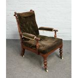 An early 19th century beech and mahogany open armchair with extensive turned decoration,