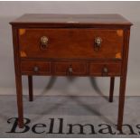 A George III inlaid mahogany rectangular writing desk, the fitted drawer over three short drawers,