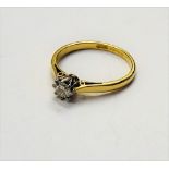 An 18ct gold and diamond single stone ring, claw set with a circular cut diamond, detailed 021,