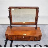 An early 19th century mahogany toilet mirror, with a bow three drawer base, 55cm wide x 50cm high.