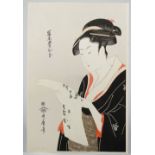 Kitagawa Utamaro (1753-1806), a Japanese woodblock print of a beauty reading a letter, signed, 38cm.