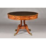 A George III ebony strung mahogany drum table,