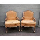 A pair of 18th century style silver framed open armchairs with serpentine seats, on scroll supports,