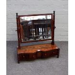 A Regency brass inlaid mahogany toilet mirror with shaped two drawer base and outswept turned