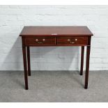 A 19th century inlaid mahogany two drawer writing table on block supports, 80cm wide x 70cm high.
