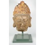 A large painted and parcel giltwood head of Guanyin,