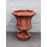 A Gothic style terracotta hexagonal garden urn, with moulded decoration, 43cm wide x 50cm high.