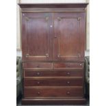 A Victorian brass mounted linen press with pair of panelled doors enclosing four trays over two