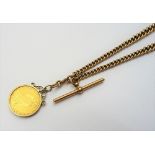 A gentleman's 9ct gold graduated curb link watch Albert chain,