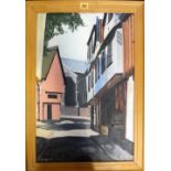 A group of five 20th century oil paintings and one watercolour, including a street scene signed F.W.